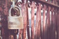 Old rusted lock on the red rusted door Royalty Free Stock Photo