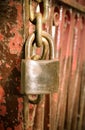 Old rusted lock on the red rusted sliding door Royalty Free Stock Photo