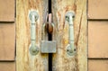 Old rusted lock on a wooden door Royalty Free Stock Photo