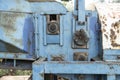 Old rusted machinery painted in blue color kept under sunglight Royalty Free Stock Photo