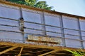 Old Rusted Metal Railroad Bridge with Restricted Clearance Sign Royalty Free Stock Photo