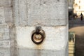 Old rusted metal ring built in a old building stone wall. Granite quay, old and rusty metal ring Royalty Free Stock Photo