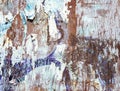 Metal surface with traces of torn posters and peeling paint Royalty Free Stock Photo