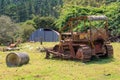 An old, rusted-out bulldozer on a farm