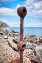 Old rusted piece of guard rail on a quay