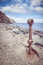 Old rusted piece of guard rail on a quay