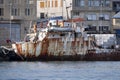Old rusted ship in harbor