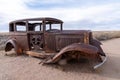 The old rusted Studebaker Landmark car that marks the start of the Painted Desert and its alignment with Route 66 in Arizona Royalty Free Stock Photo