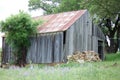 Old Rusted Tin Roof covering walls faded grey with time