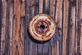 Old Rusted Tire Rim on Barn Wall Royalty Free Stock Photo