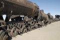 Old rusted train on the tracks under a blue sky