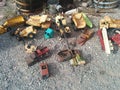 Old, rusted vintage toy vehicles on the ground