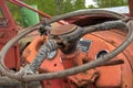 Old rusted and weathered tractor steering wheele