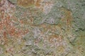 Old rusted weathered and uneven stone wall texture background