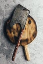 Old rustic axe for meat on a wooden board Royalty Free Stock Photo