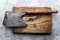 Old rustic axe for meat on a wooden board Royalty Free Stock Photo