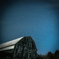 Old rustic barn with Big Dipper and Pole star in winter