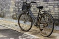 Old Rustic Bicycle Leaning Against a Brick Wall Royalty Free Stock Photo