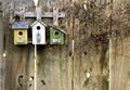 Old rustic birdhouses on fence Royalty Free Stock Photo