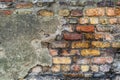 Old rustic brick wall with bits of grey plaster - high quality texture / background