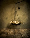 Old rustic cast iron scales holding onions on antique tiles and cement wall background