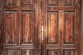 Old, rustic, classical, brown, wooden door with iron door handle. Door textures and background. Royalty Free Stock Photo
