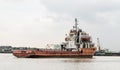 Old rustic construction ship on river