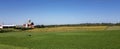 Old rustic dairy farm in Wisconsin - barn, crop fields, meadows. Panoramic landscape banner. Royalty Free Stock Photo