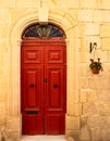 Old rustic door on a mediterranean house of stone Royalty Free Stock Photo