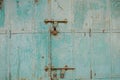 Old rustic door with blue peeling paint,rusty hinges, a  padlock,in Mandawa haveli Rajasthan India Royalty Free Stock Photo