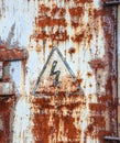 Old rustic doors with dangerous lightning sign