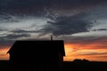 An old rustic farm building silhouette on the Alberta prairies Royalty Free Stock Photo