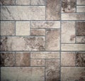 Old rustic floor with aged stone tiles of different sizes geometrically arranged Royalty Free Stock Photo