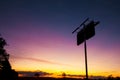 Old rustic fuel station sign as a silhouette. Royalty Free Stock Photo