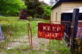 Old rustic keep out sign on metal gate Royalty Free Stock Photo