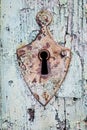 Old rustic lock and keyhole on a vintage wooden door Royalty Free Stock Photo