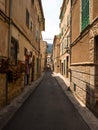 Old rustic mediterranean traditional house facade wall narrow alley lane road street Mallorca Balearic Islands Spain Royalty Free Stock Photo