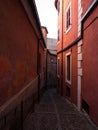 Old rustic mediterranean traditional house facade wall narrow alley lane road street in Toledo Castilla La Mancha Spain Royalty Free Stock Photo