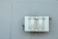 Old rustic North American electrical outlet on a exterior brick wall Royalty Free Stock Photo