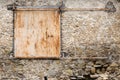 Old rustic solid metal sliding shutters in very old stone house Royalty Free Stock Photo