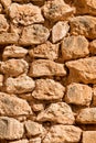 Old rustic stone wall made using only natural materials. Royalty Free Stock Photo