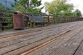 Old rustic vintage bench and rusty trash bin