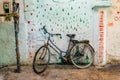 Old rustic vintage bicycle on the street near the color wall. Travel concept. Bike ride. Postcard Royalty Free Stock Photo