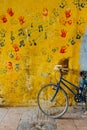 Old rustic vintage bicycle on the street near the color wall. Travel concept. Bike ride. Postcard Royalty Free Stock Photo