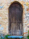 Old rustic wooden door with blue step Royalty Free Stock Photo