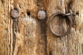 Old rustic wooden door with a ring handle Royalty Free Stock Photo