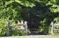 old rustic wooden fence marking forest path