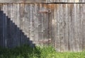 Old rustic wooden gate with rusty hinges Royalty Free Stock Photo