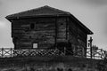 Old rustic wooden house on top of a hill in black and white Royalty Free Stock Photo