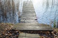 Old rustic wooden steps leading to a jetty Royalty Free Stock Photo